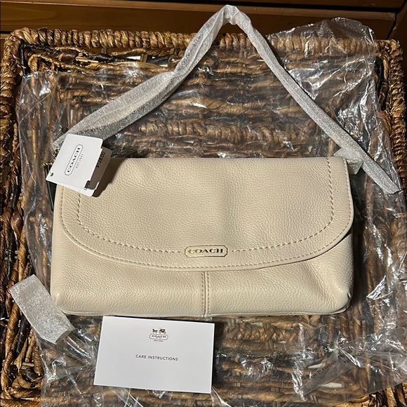 Coach Handbags - Coach Cream Pebble Leather Large Wristlet With Curved Flap Design BNWT